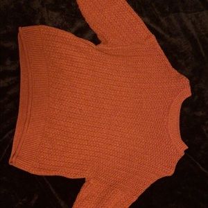 Dark red long sleeve sweater.